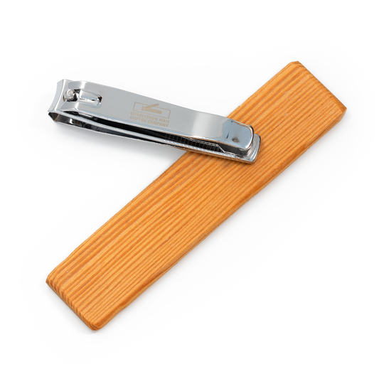 Charleston nail clippers with fir wood base, extended on a pivot